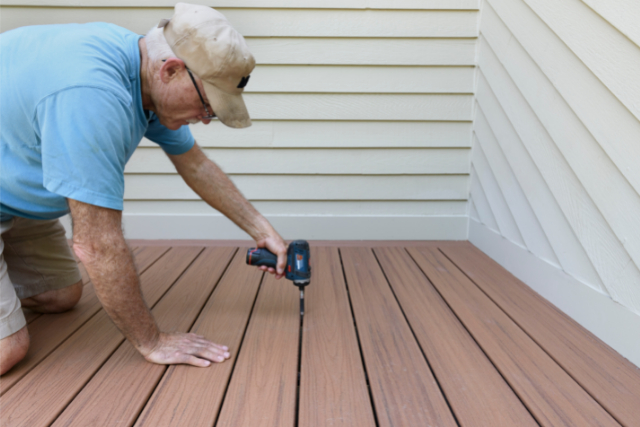 Builder Installing New Composite Wood Deck